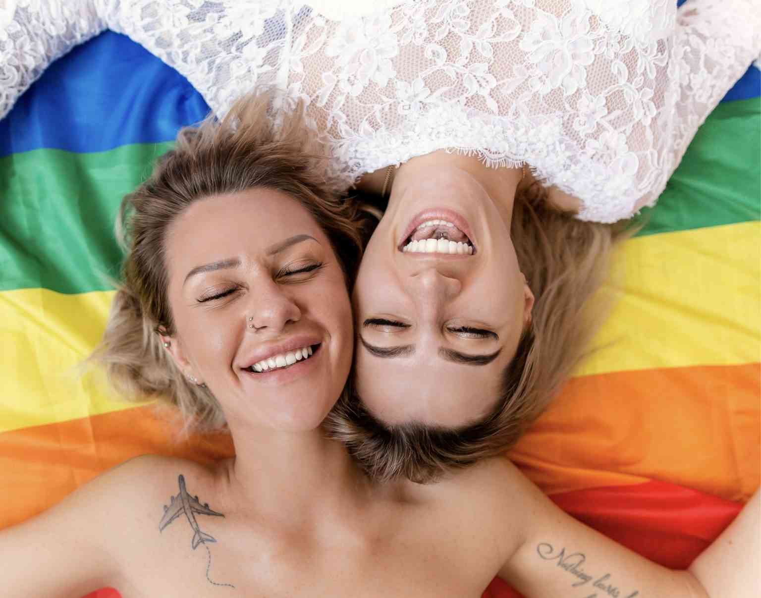 Happy women with rainbow flag