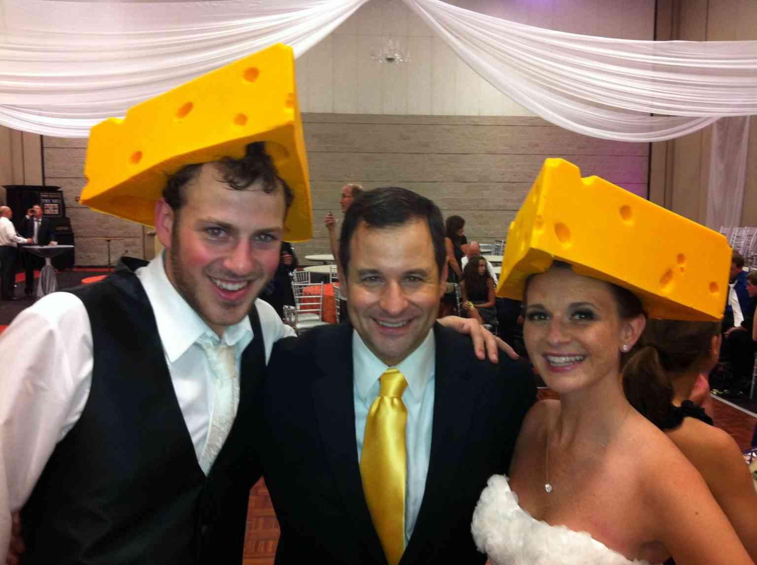 David with couple in cheese hats